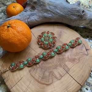 Sarah Coventry matching bracelet and brooch in gold, light green and deep orange
